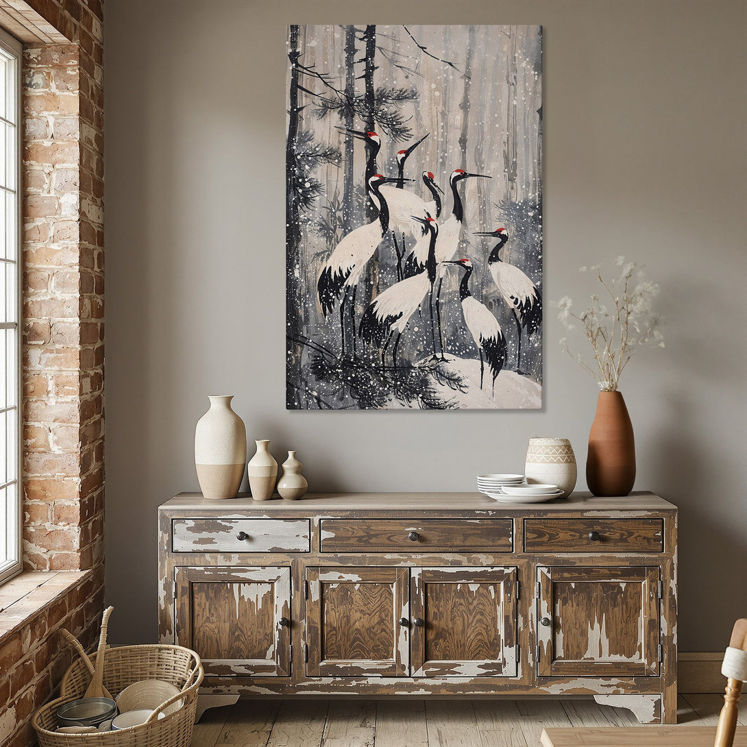 Framed Wall Art featuring cranes in a snowy forest scene. Neutral color palette with black, white, and red accents. Perfect for modern home decor.