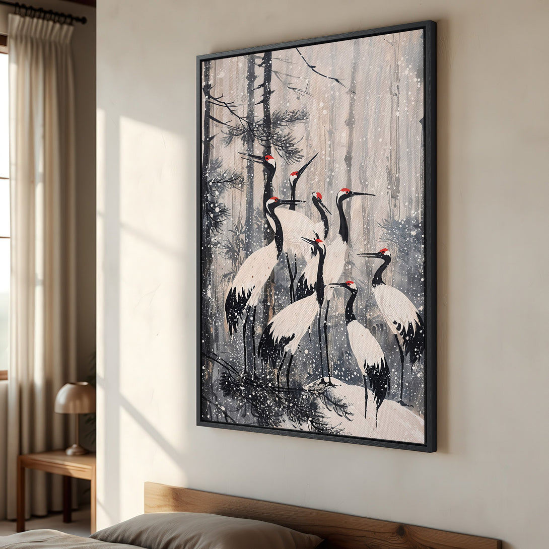 Framed Wall Art featuring cranes in a snowy forest scene. Japanese-inspired art with a neutral color palette. Perfect for adding a touch of zen to your home.