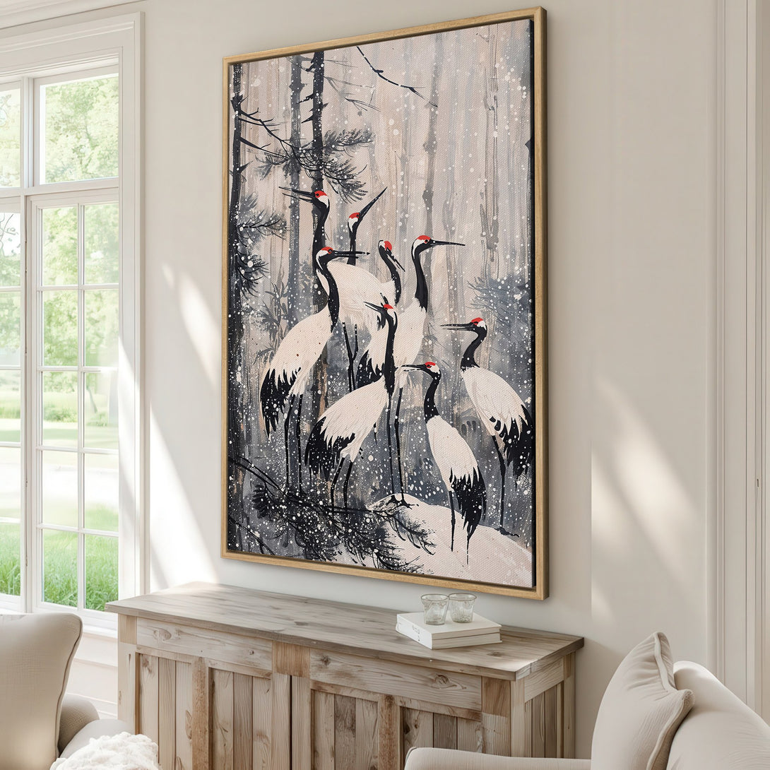 Framed Wall Art featuring elegant cranes in a snowy forest scene. Neutral color palette with pops of red. Perfect for modern home decor.