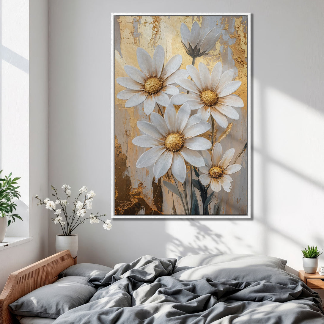 Framed Wall Art featuring white daisies with gold accents, displayed in a bedroom. Neutral color palette with a touch of elegance.