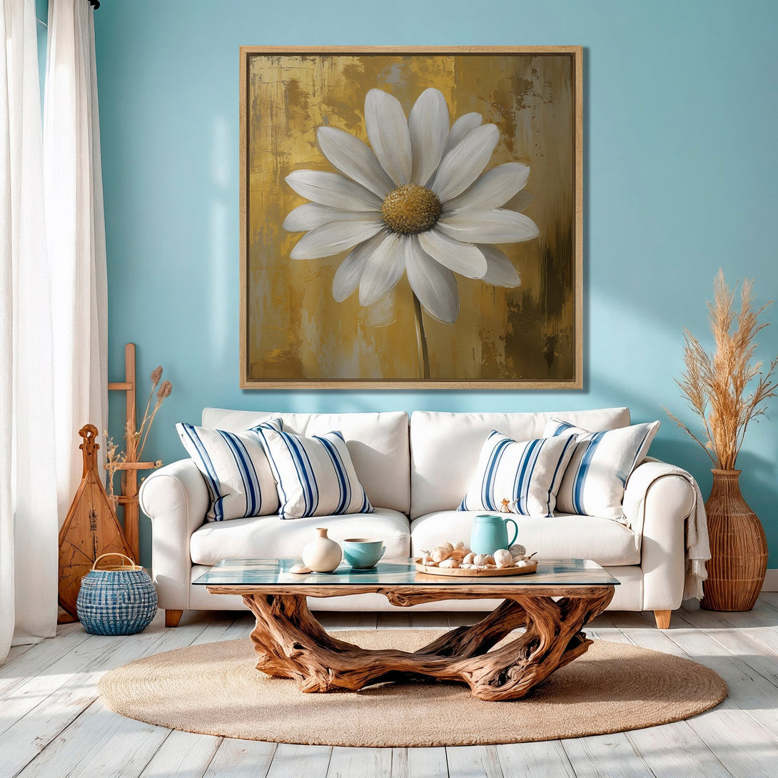 Framed Wall Art: Large daisy painting in gold and white. Coastal decor inspiration in a blue and neutral living room. Add a touch of nature to your space.