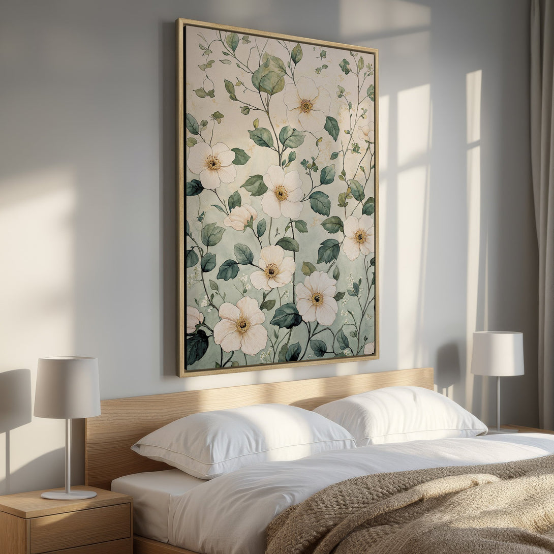 Framed Wall Art: Watercolor floral print in a bedroom. Soft, neutral color palette with white flowers and green leaves. Perfect for adding a touch of nature.