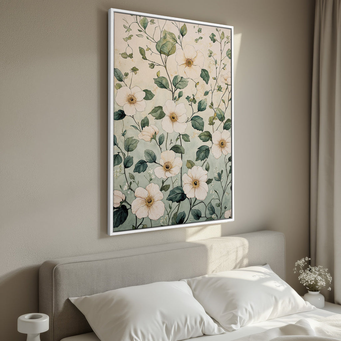 Framed Wall Art featuring a watercolor floral design in soft green and cream tones. Perfect for adding a touch of elegance to any bedroom or living space.