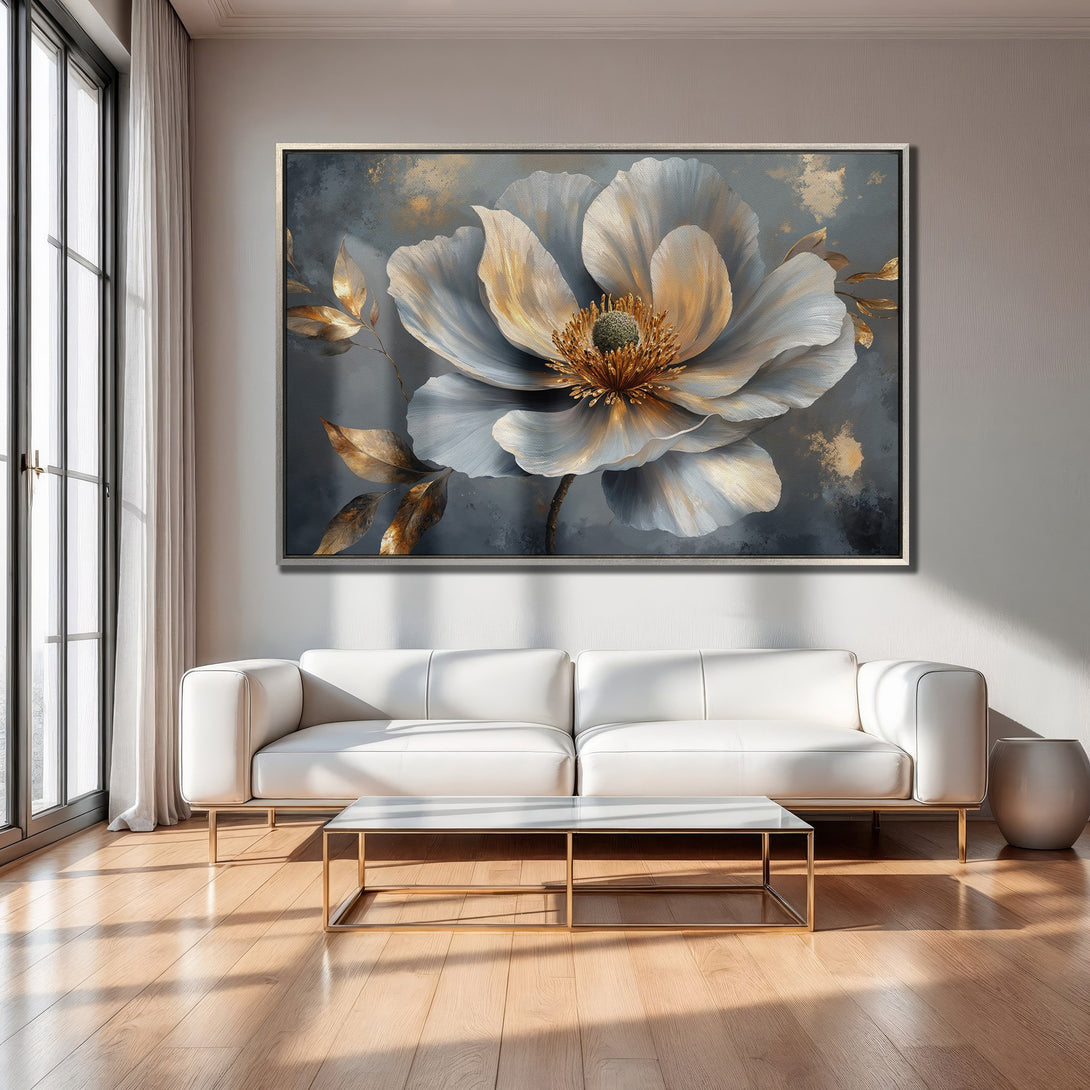 Framed Wall Art: Elegant floral canvas print in a modern interior. Features a large white flower with gold accents on a gray background.