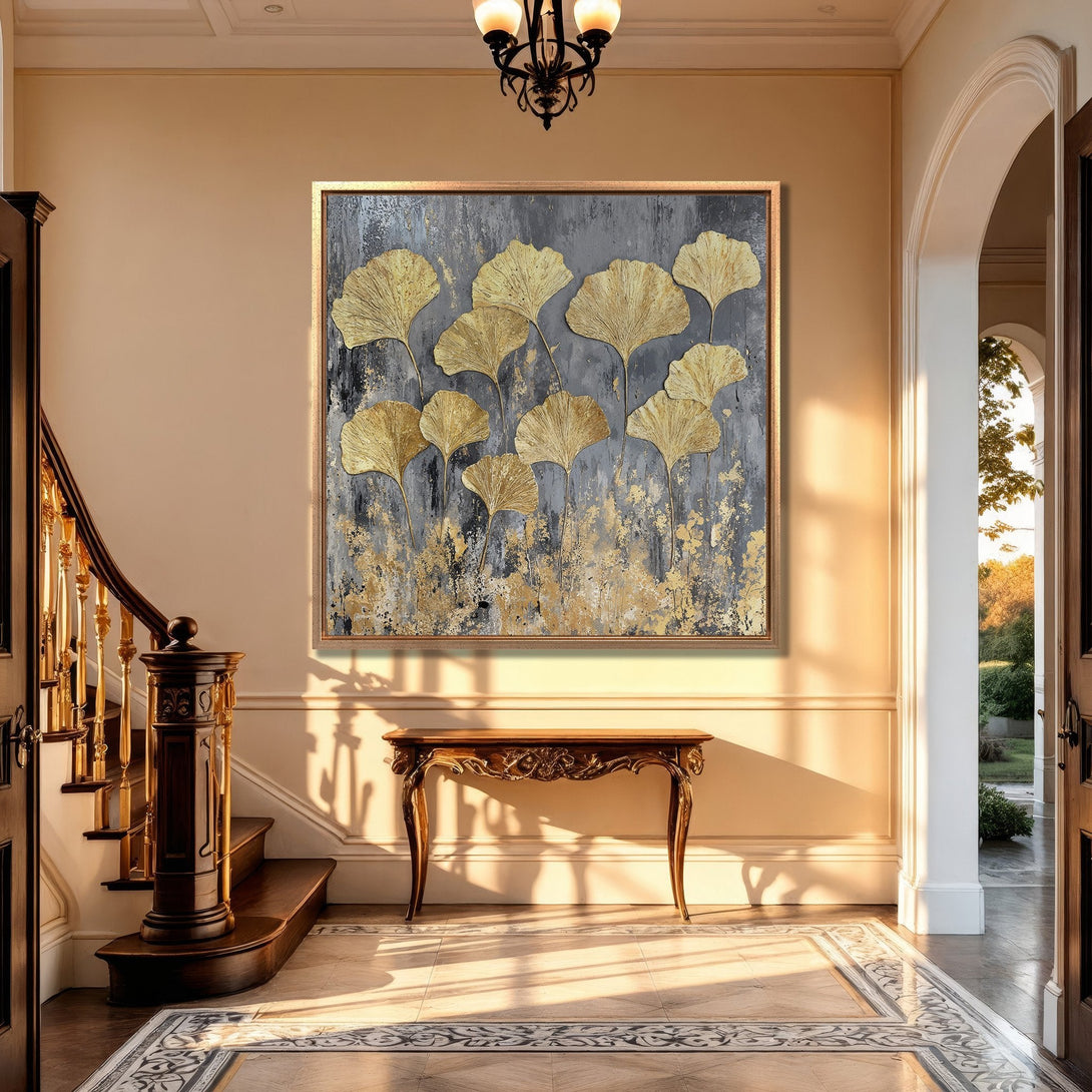 Framed Wall Art: Gold leaf ginkgo art print in a luxurious interior. Modern abstract style with a gray and gold color palette, perfect for elegant home decor.