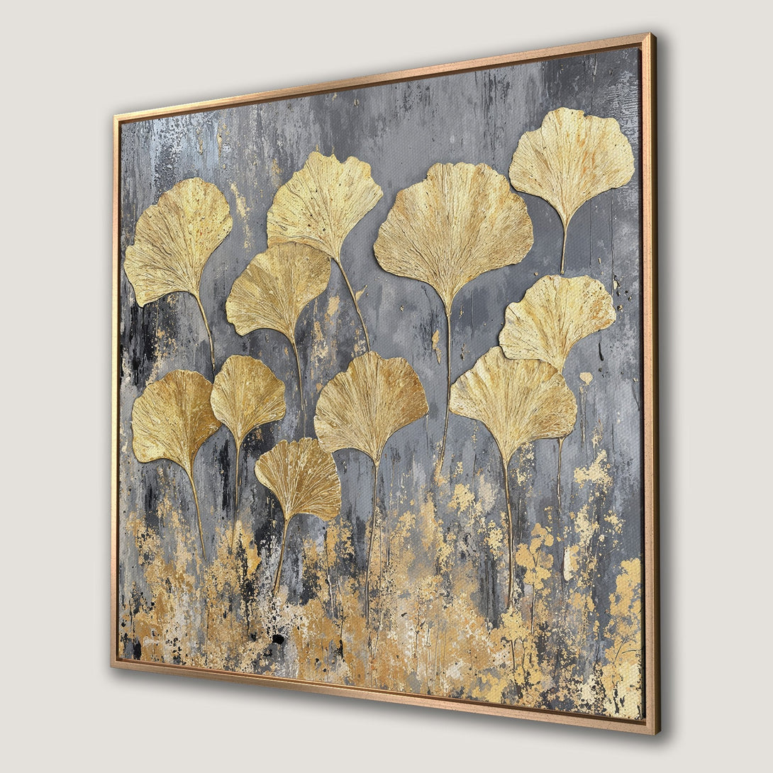 Framed Wall Art featuring gold ginkgo leaves on a textured gray background. Modern abstract art with a neutral, elegant color palette.