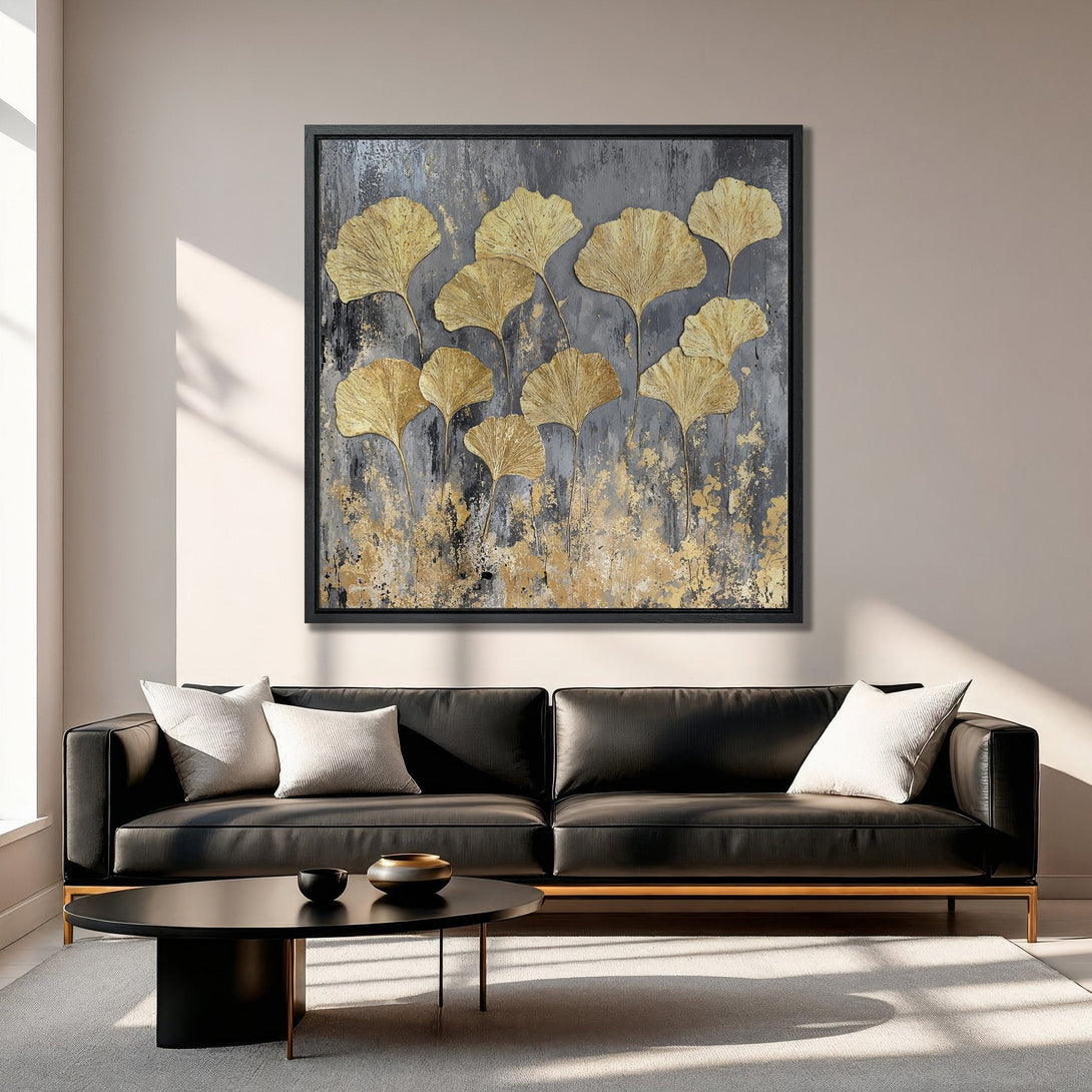 Framed Wall Art featuring gold ginkgo leaves on a textured gray background. Modern, elegant canvas print with a neutral and gold color palette, perfect for home decor.
