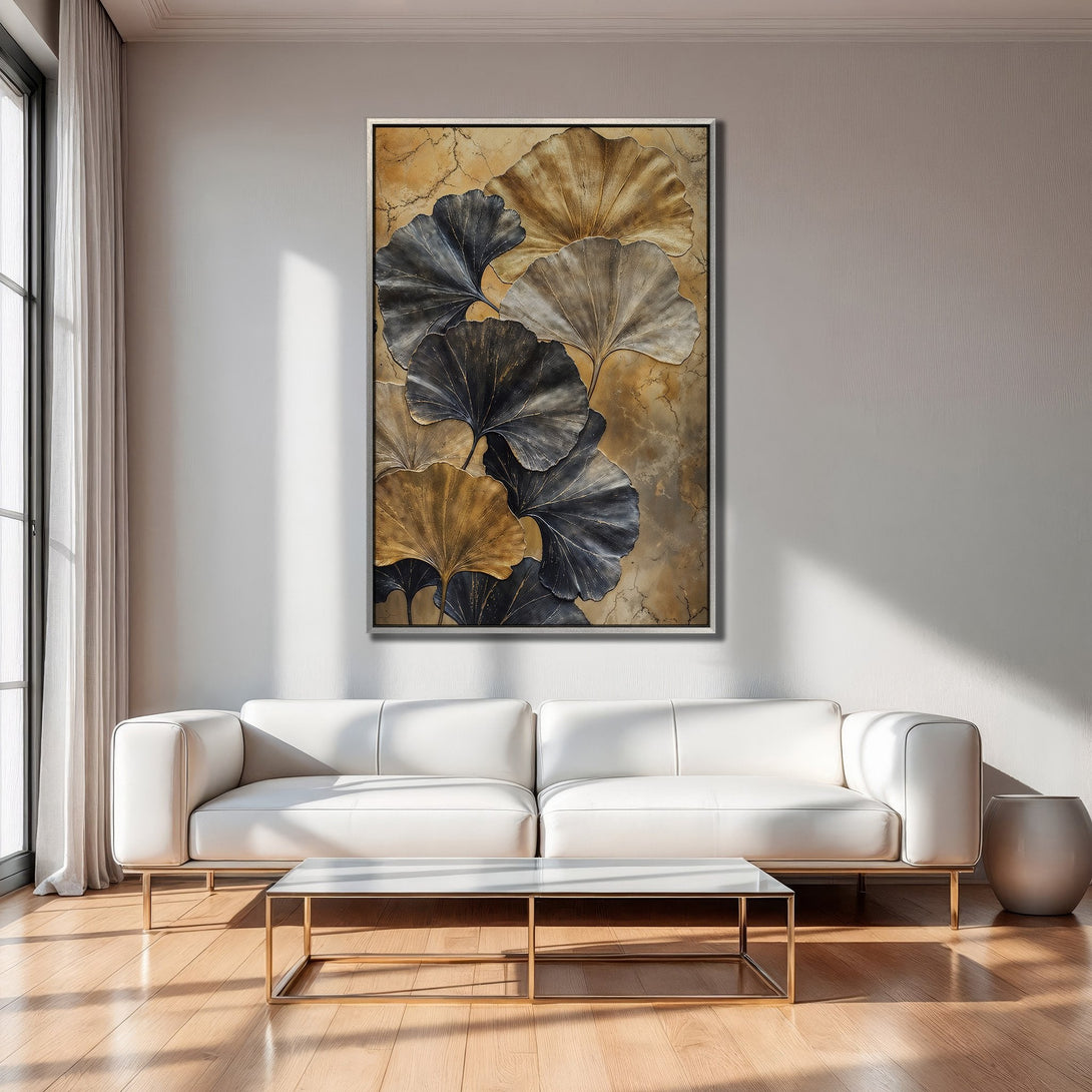 Framed Wall Art: Abstract ginkgo leaf print in gold & charcoal tones. Modern art for living room decor. Enhance your space with this elegant piece.