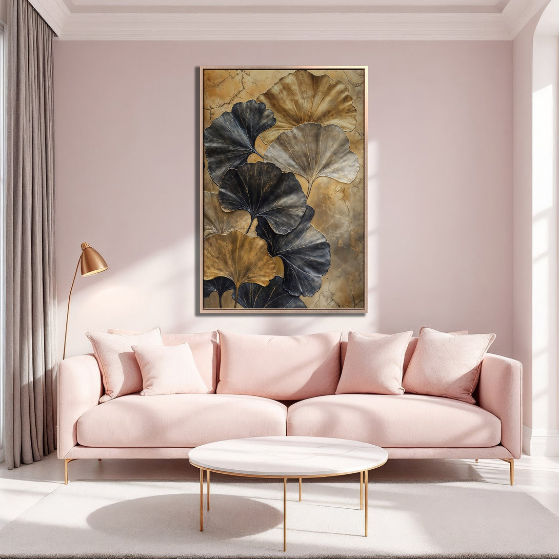 Framed Wall Art featuring abstract ginkgo leaves in gold & charcoal hues. Modern art print perfect for adding elegance to any living room.