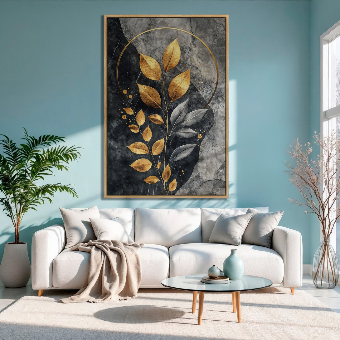 Framed Wall Art featuring golden leaves on a dark background. Modern abstract art in a living room with a blue and gold color palette. Elevate your home decor!