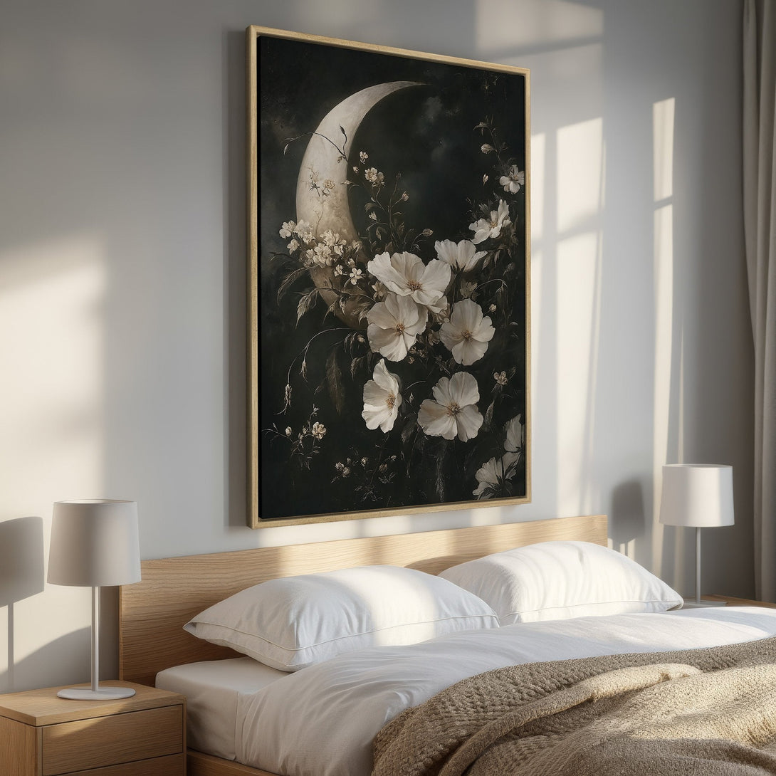 Framed Wall Art: Floral moon art print in a bedroom. Elegant, dark, and moody color palette with white flowers against a black background.