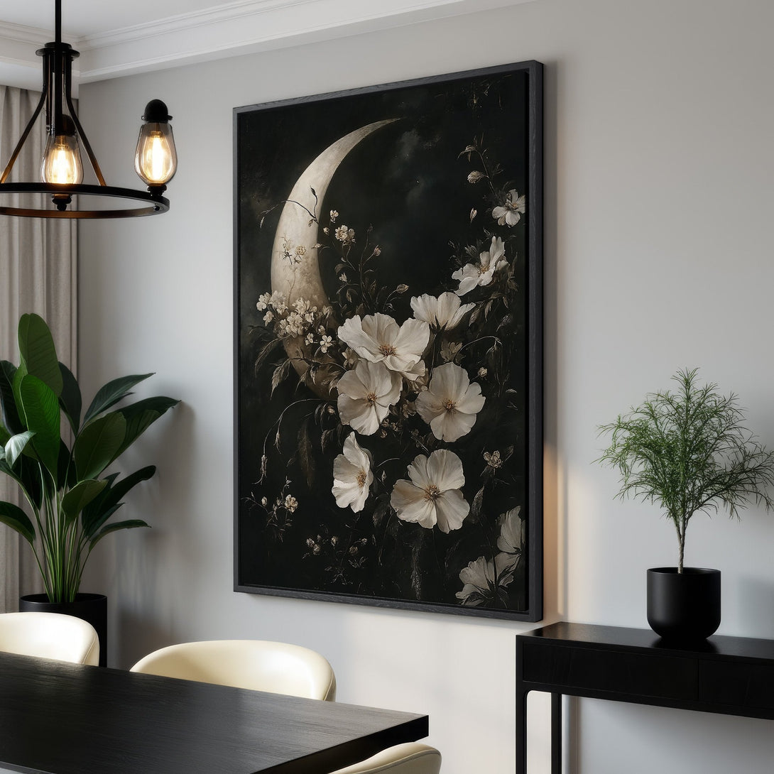 Framed Wall Art featuring a moon and floral design in a dark, moody style. Elegant black and white color palette, perfect for adding sophistication to any room.