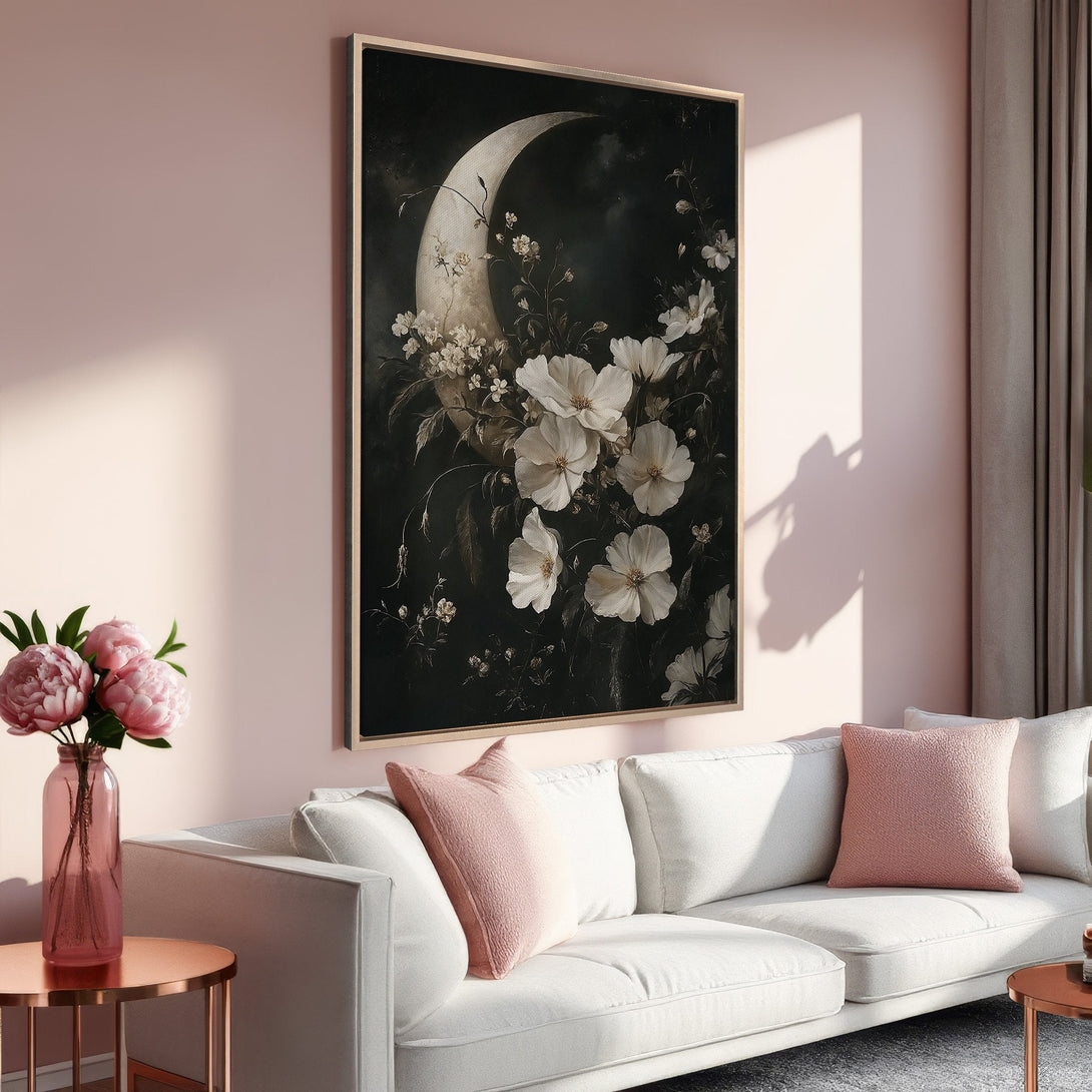 Framed Wall Art featuring a floral moon design in a dark, moody style. Soft pink and white color palette. Perfect for adding elegance to your space!