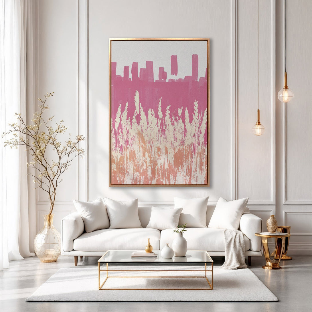 Framed Wall Art: Abstract pink and peach painting in a gold frame. Modern art decorates a bright, white living room. Add a touch of color to your space!