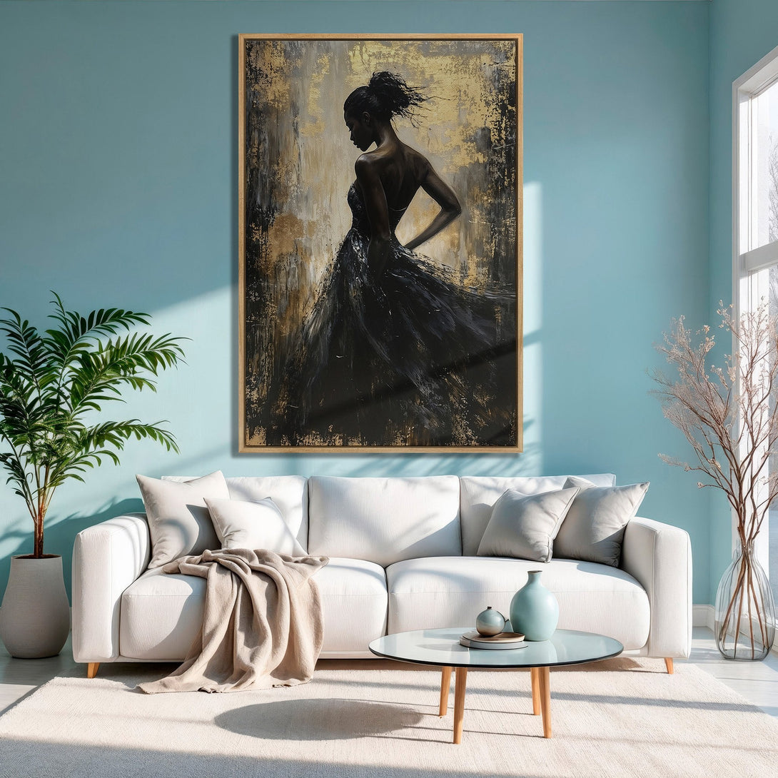 Framed Wall Art: Elegant black and gold abstract painting of a woman, displayed in a modern living room with a serene blue and neutral color palette.