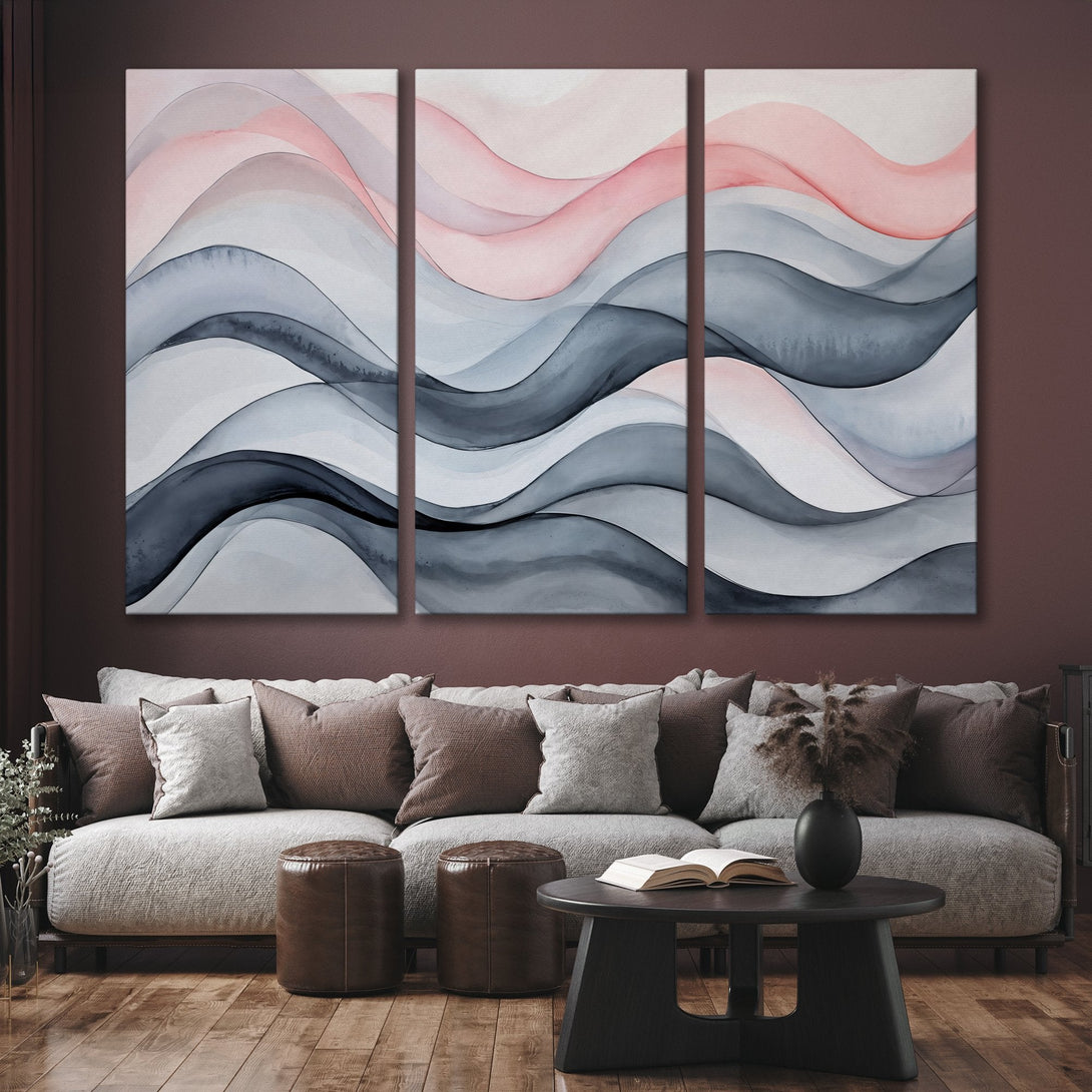 Abstract Canvas Print triptych in watercolor style. Features flowing waves in gray, pink, and white tones. Perfect for modern home decor.