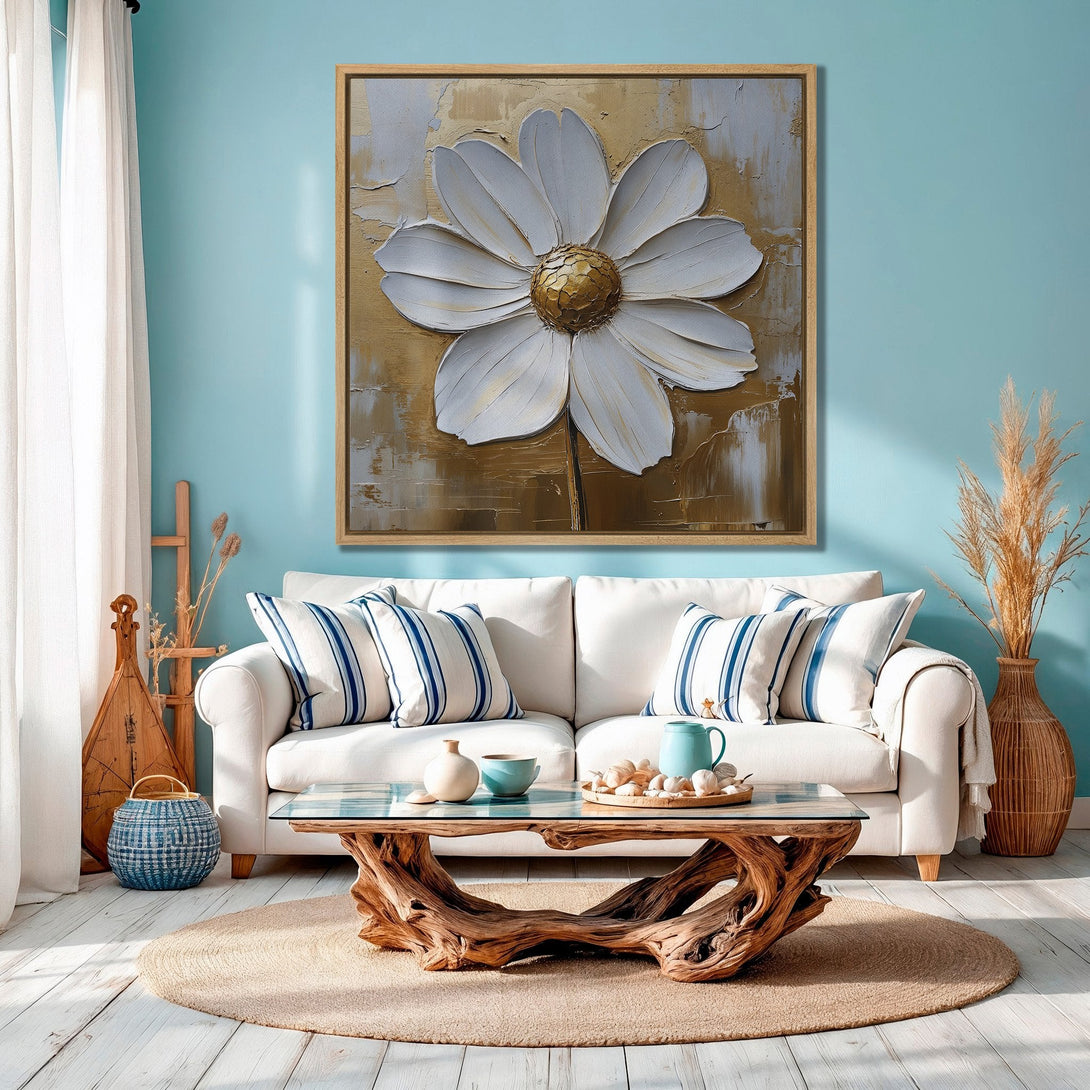 Framed Wall Art: Stunning textured daisy painting in gold and white, adding a touch of elegance to a coastal-style living room with blue accents.