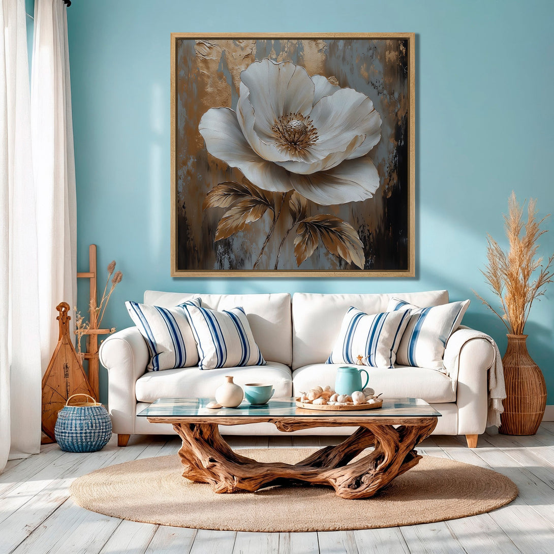 Framed Wall Art featuring a stunning white flower painting. Coastal style with a calming blue, gold, and neutral color palette. Elevate your home decor!