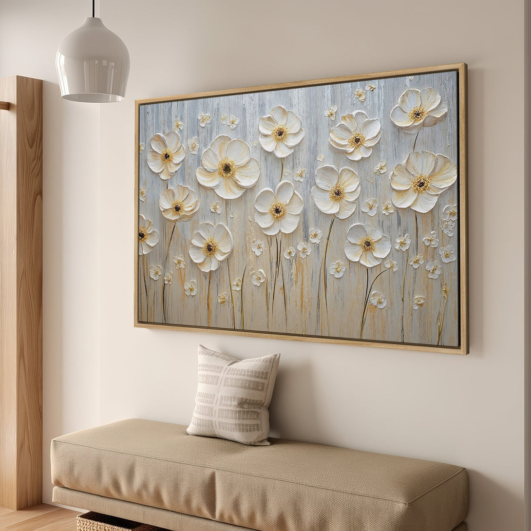 Framed Wall Art featuring textured white floral design. Neutral color palette with gold accents. Perfect for adding a touch of elegance to any space.