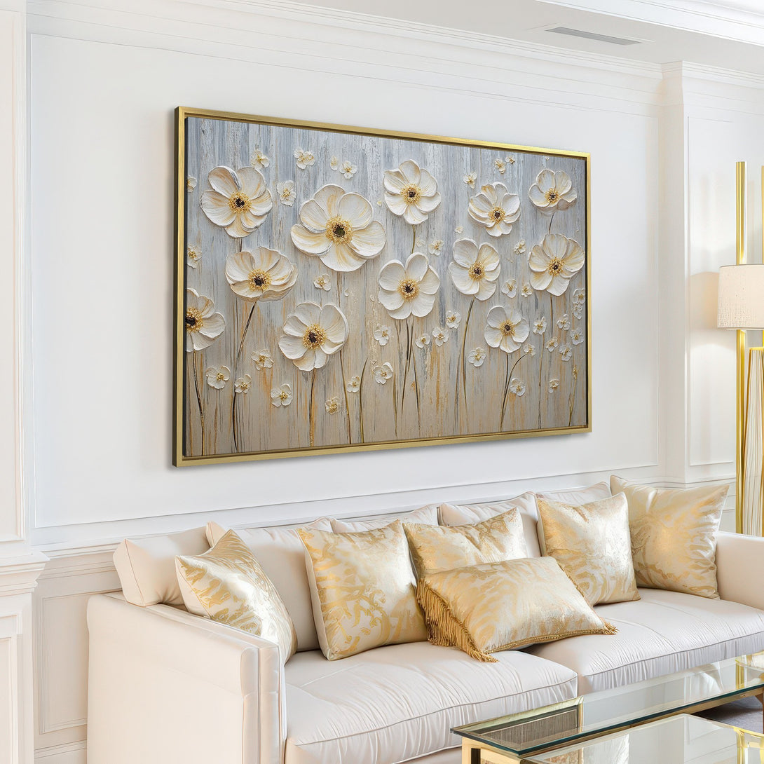 Canvas Print of white floral art in a neutral, modern living room. Features textured flowers in cream and gold tones.
