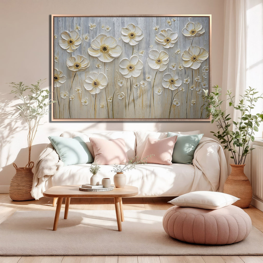 Framed Wall Art featuring textured white floral design. Neutral color palette with pops of gold. Perfect for adding a touch of elegance to any space.