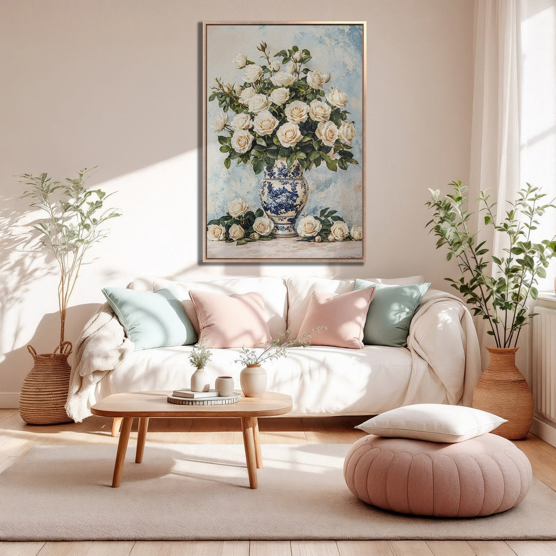 Framed Wall Art: Elegant floral print with white roses in a blue vase. Soft, neutral color palette perfect for a cozy living room. Shop now!