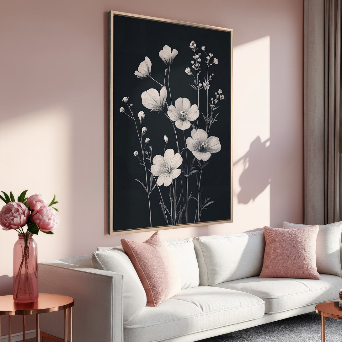 Framed Wall Art featuring elegant floral sketch on a black background. Soft pink and neutral color palette enhances the minimalist, modern interior design.