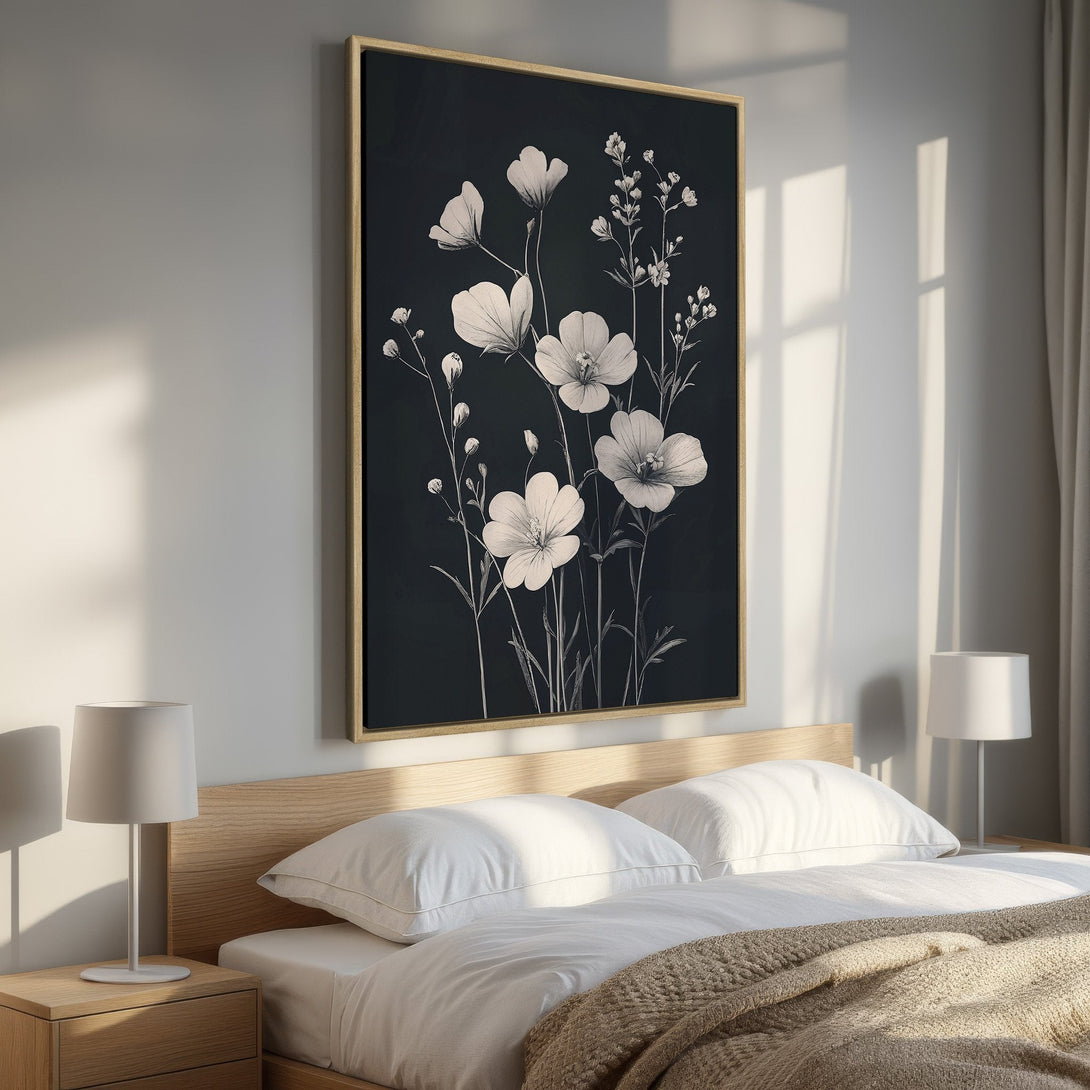 Framed Wall Art: Elegant floral print in monochrome style, perfect for bedroom decor. Features white flowers on a dark background.