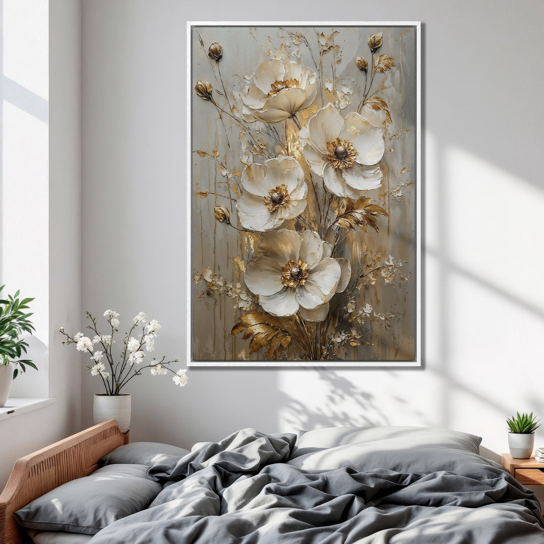 Framed Wall Art: Elegant floral canvas print in neutral tones. Features white flowers with gold accents, perfect for bedroom decor.