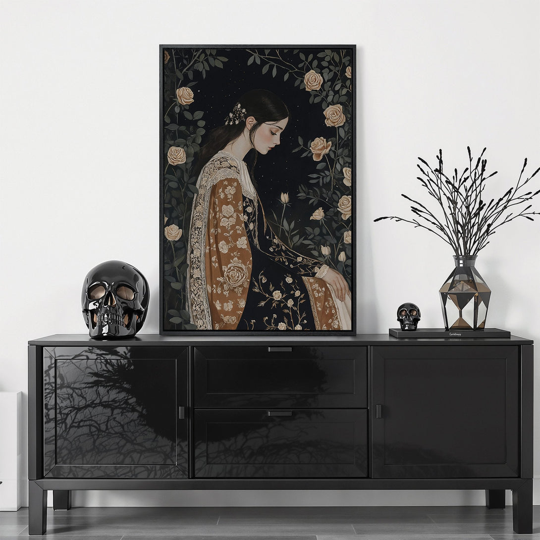 Framed Wall Art featuring a woman in a floral setting with a dark, moody color palette. Perfect for adding elegance and style to your home decor.