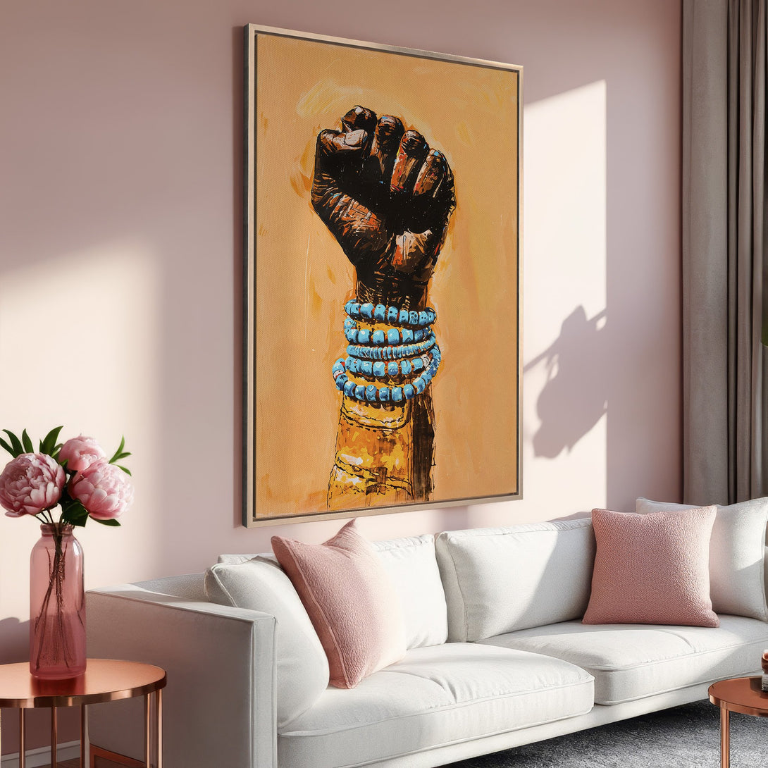 Framed Wall Art: Powerful black fist with turquoise bracelets, warm neutral tones. Modern art print for living room decor.