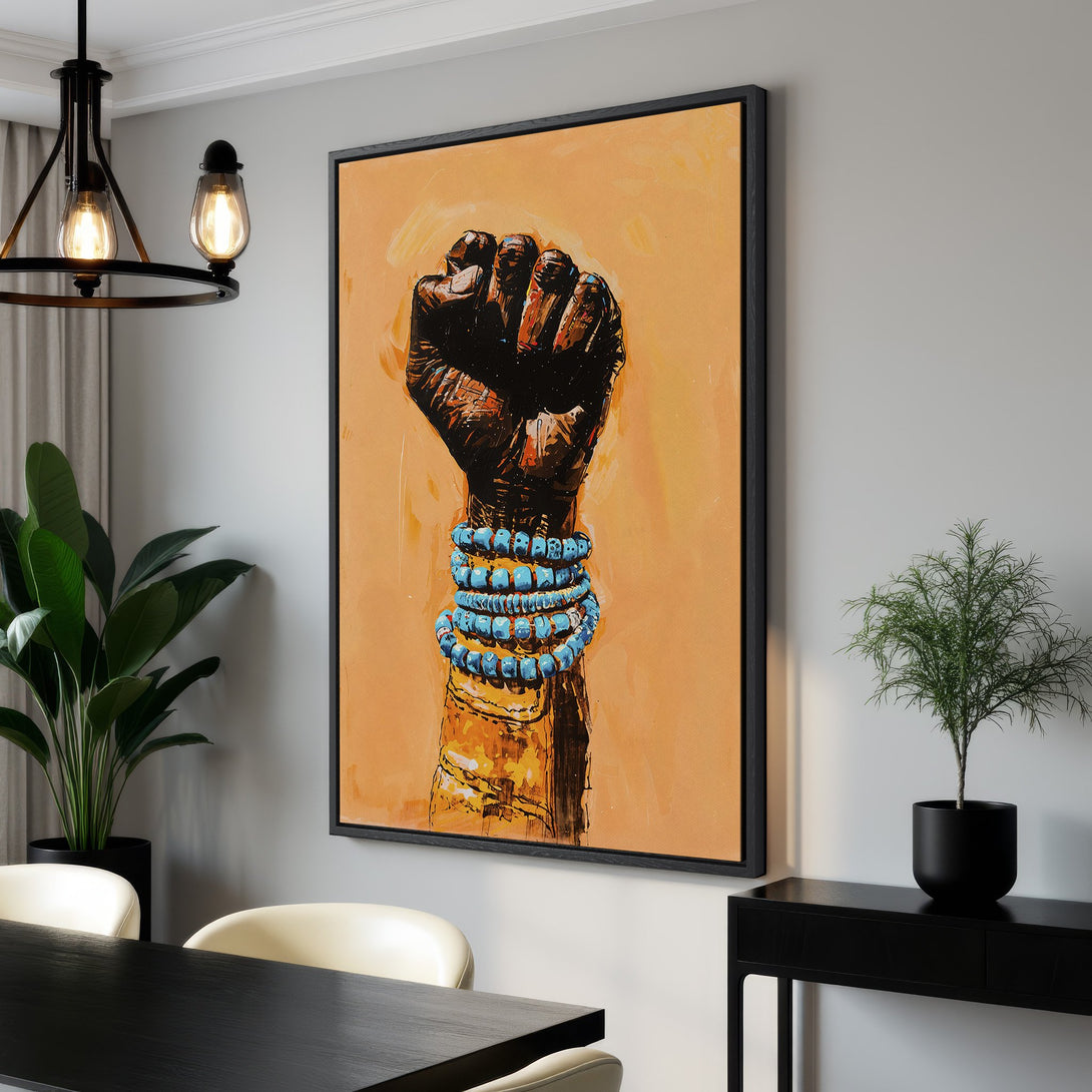 Framed Wall Art featuring a powerful fist in an abstract style, showcasing a warm orange and black color palette. Perfect for modern home decor.