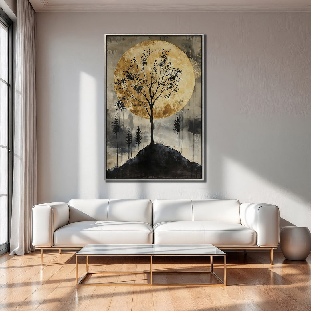 Framed Wall Art: Abstract tree silhouette against a golden moon. Earthy tones of gold, black, and gray create a calming, modern aesthetic. Perfect for any space.