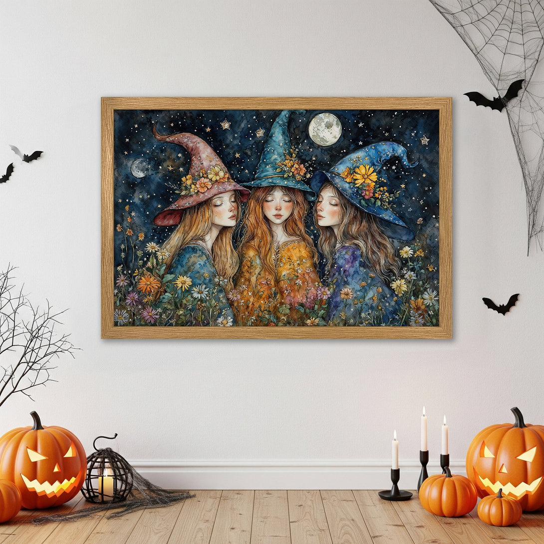 Framed Poster featuring a watercolor painting of three witches with floral hats. Dark blue, orange, and pastel color palette. Halloween decor.
