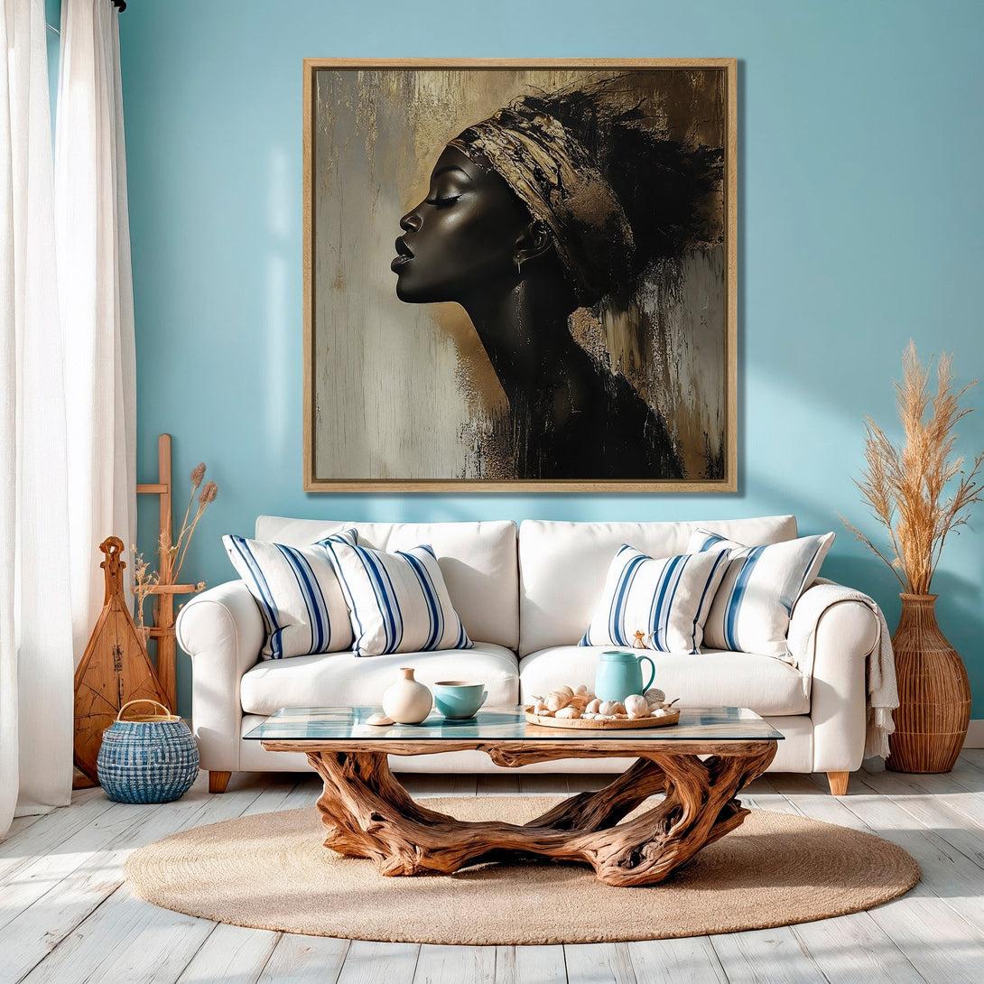 Framed Wall Art featuring a black woman in profile, abstract style, with gold and black tones, displayed in a coastal living room.