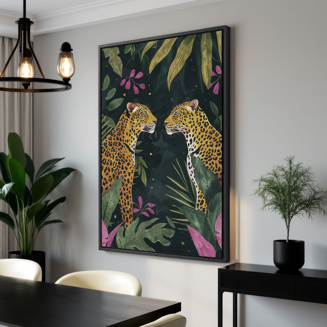 Framed Wall Art featuring two leopards in a jungle setting. Tropical style with a dark green, gold, and pink color palette. Perfect for adding a touch of the wild.