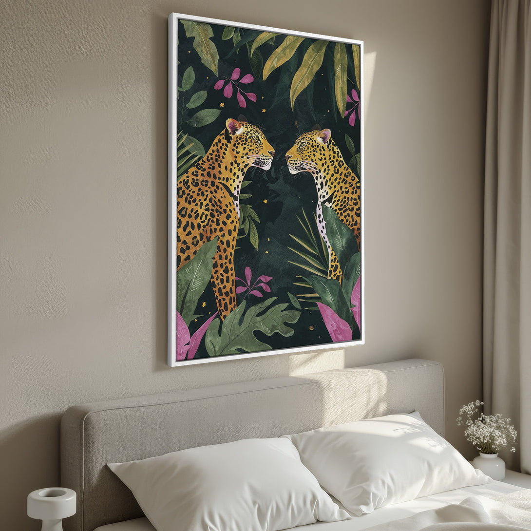 Framed Wall Art featuring two leopards in a lush jungle setting. Tropical style with a dark green, gold, and pink color palette. Perfect for bedroom decor.