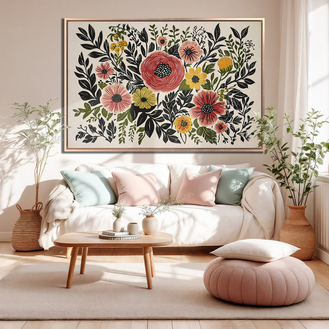 Framed Wall Art: Floral Canvas Print in a modern living room. Features a botanical design with red, yellow, and black on a neutral background.