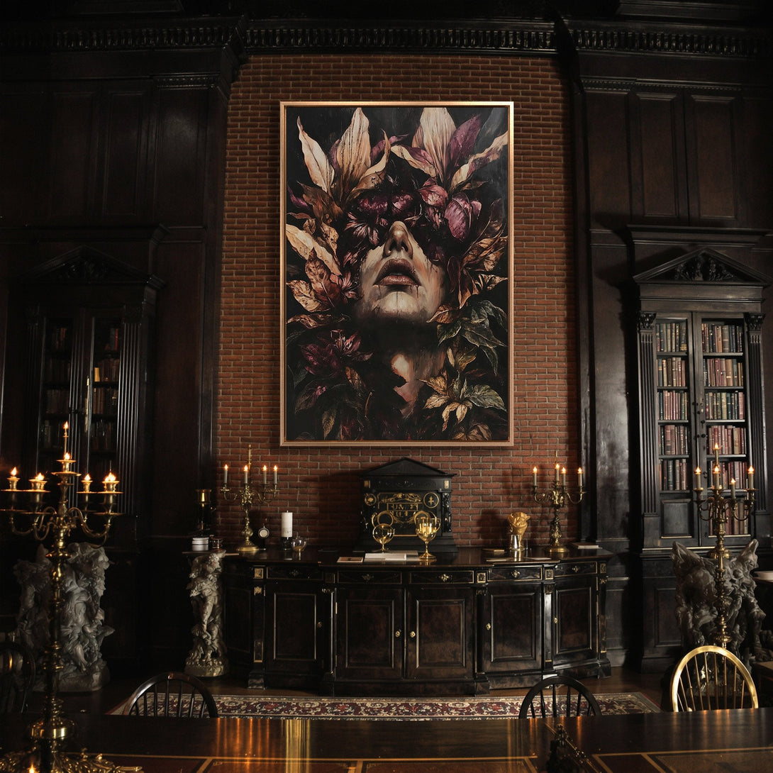 Framed Wall Art: Moody floral portrait canvas print in a dark interior. Featuring a woman's face with muted purple, brown, and green tones. Elevate your space!