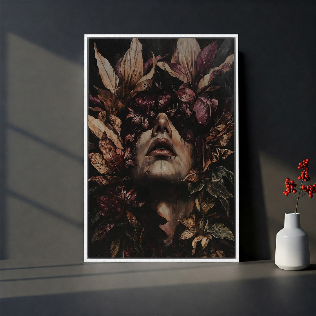 Framed Wall Art featuring a woman's face with leaves, dark moody tones. Perfect for adding artistic flair to your home decor. Canvas Print available.