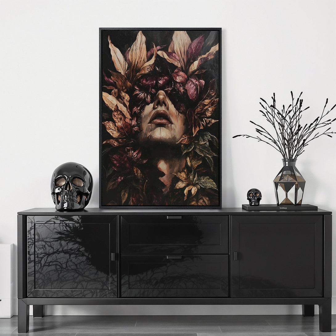 Framed Wall Art featuring a woman's face with floral crown, dark and moody style. Earthy tones of brown, purple, and green create a captivating Canvas Print.