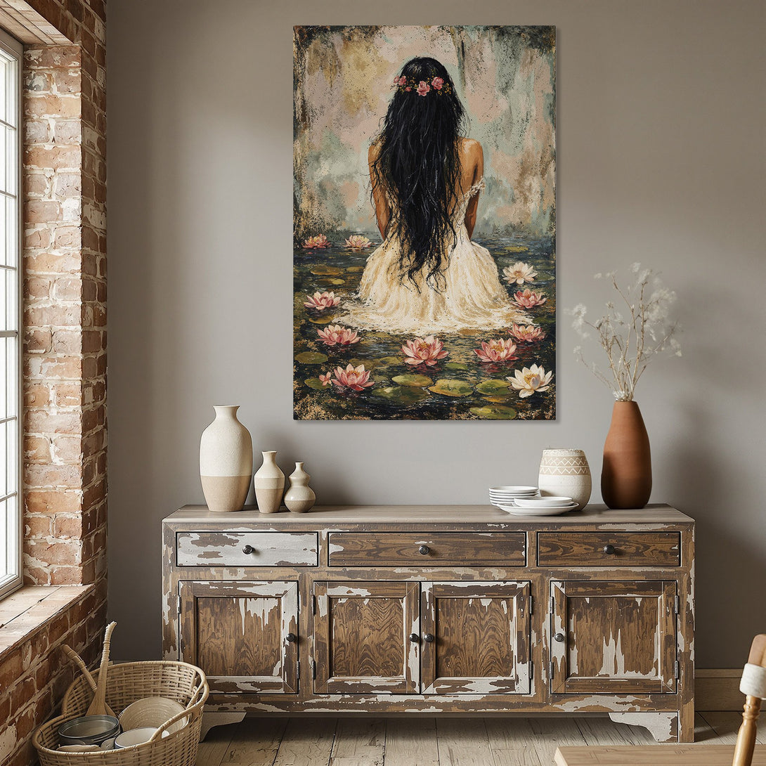 Framed Wall Art featuring a woman in a pond with pink lotus flowers. Soft, impressionistic style with a muted, warm color palette. Perfect for home decor.
