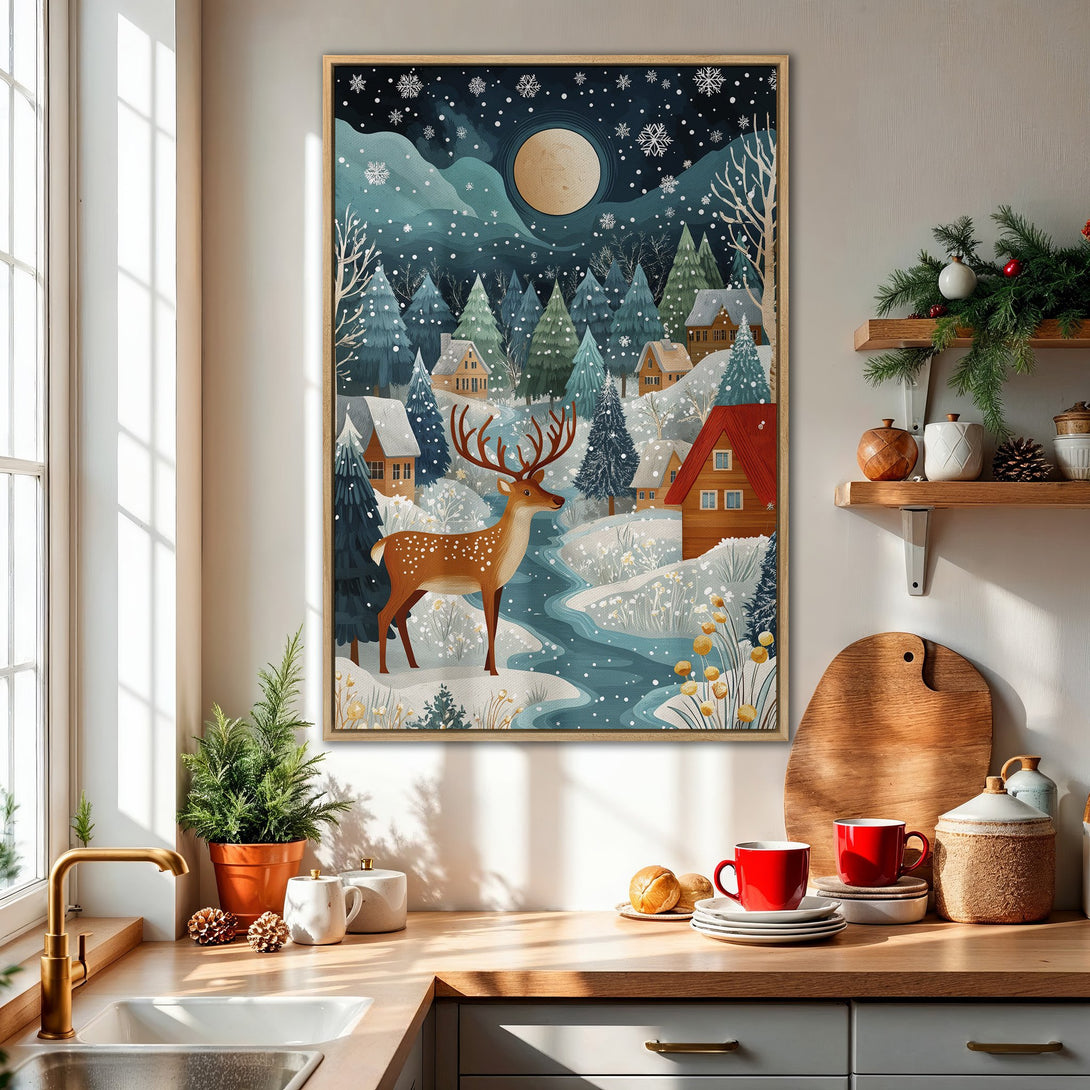 Framed Wall Art featuring a winter landscape with a deer, houses, and a full moon. Cool blue and green tones create a cozy, inviting atmosphere.