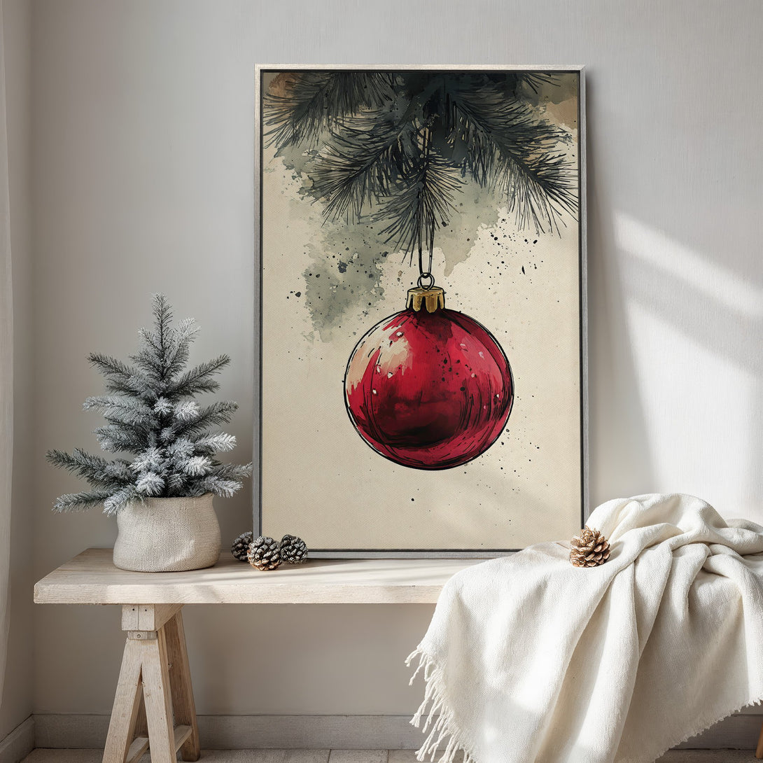 Framed Wall Art featuring a watercolor-style Christmas ornament in a red hue. Neutral tones and a cozy aesthetic perfect for holiday decor.