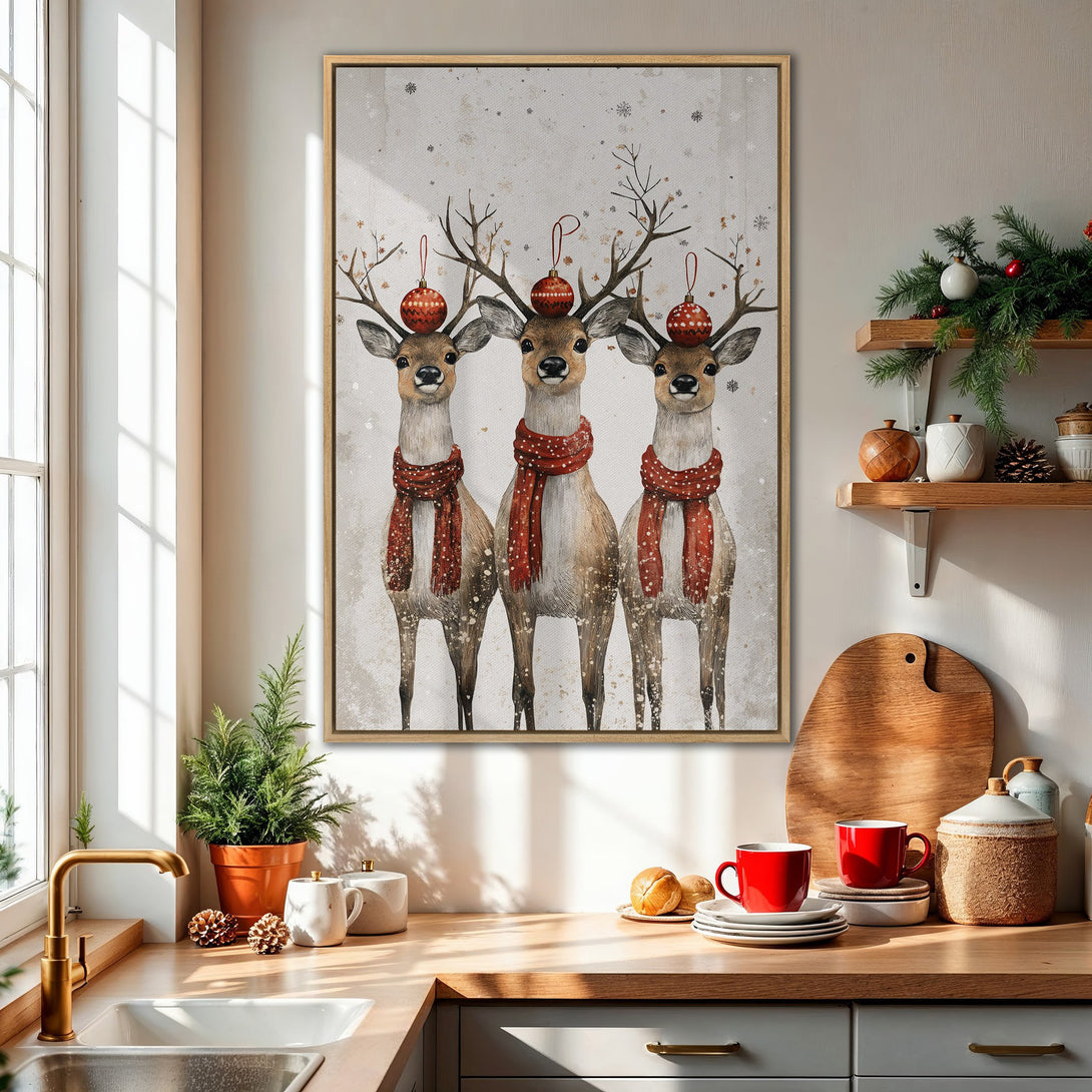Framed Wall Art featuring three festive deer in red scarves. Charming watercolor style with a neutral, wintery color palette. Perfect holiday decor!