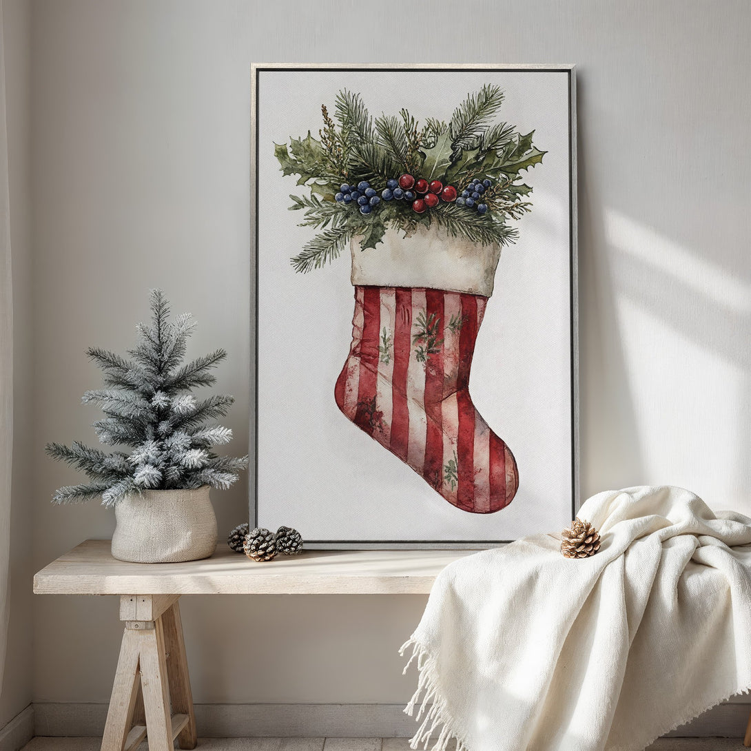 Framed Wall Art: Watercolor Christmas stocking print with red & white stripes, greenery & berries. Rustic style, neutral interior decor.
