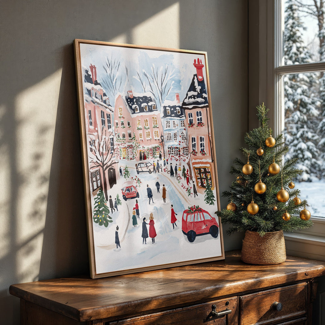 Framed Wall Art: Watercolor winter village scene in soft pinks, blues, and reds. Perfect for holiday decor!