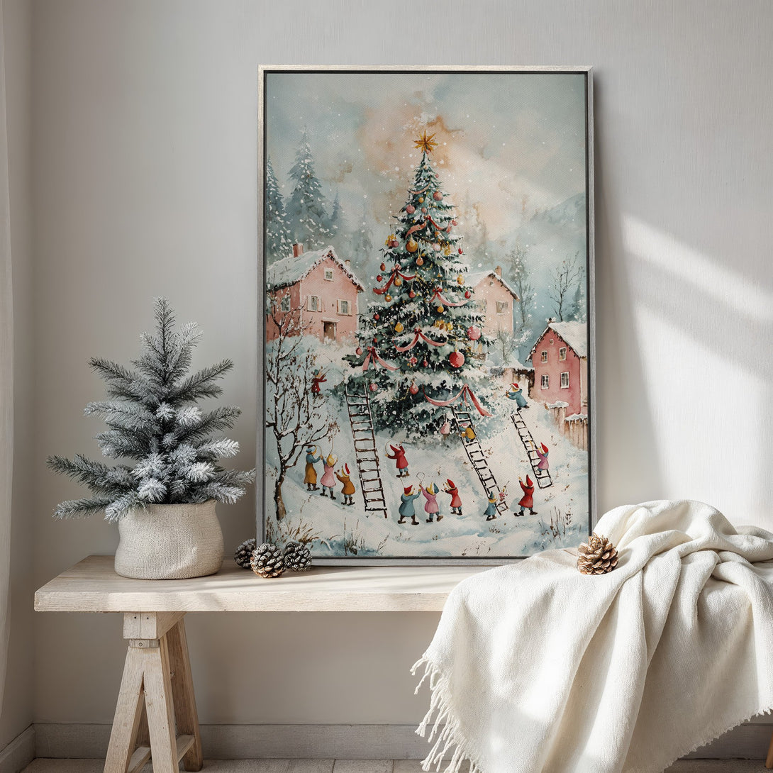 Framed Wall Art: Whimsical watercolor Christmas scene with a decorated tree, pink houses, and playful figures. Soft blues, pinks, and greens create a cozy winter aesthetic.