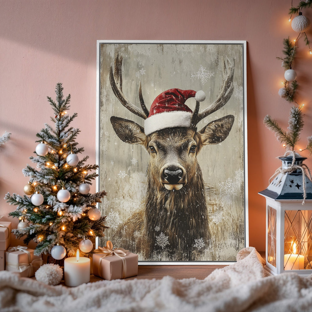 Framed Wall Art: Festive deer in Santa hat, rustic style, neutral & red tones. Perfect Christmas decor! Shop our Canvas Print collection now.