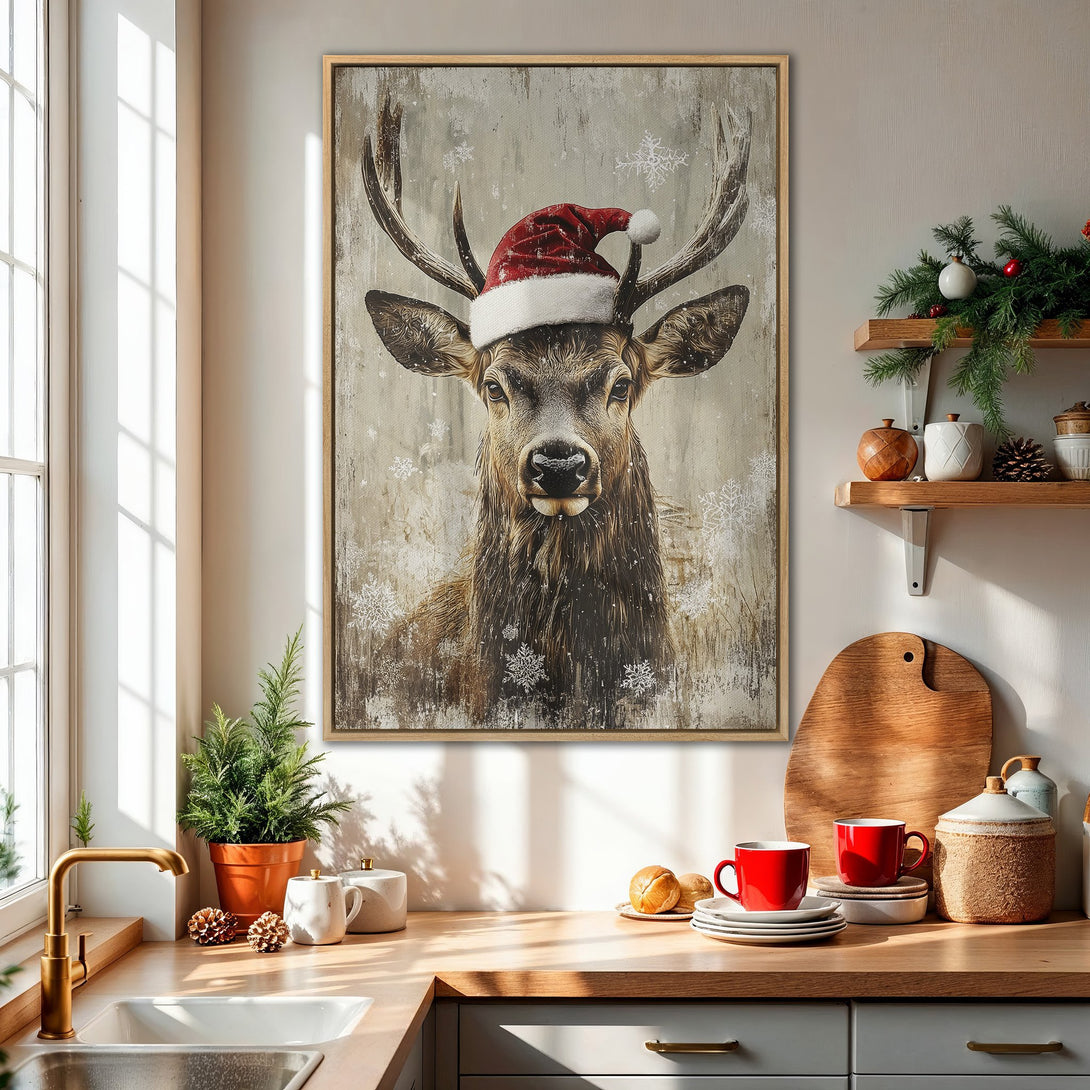 Framed Wall Art: Rustic Christmas deer print in neutral tones with a red Santa hat. Perfect holiday decor for a cozy kitchen.